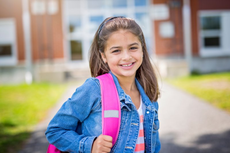 child smiling after visiting children’s dentist in Dallas