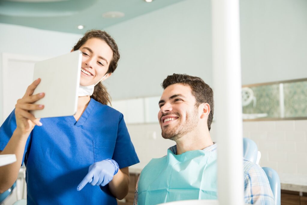 Dentist explains matters to patient